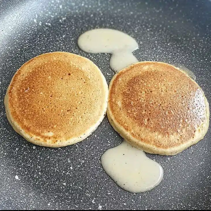 High-Protein Cottage Cheese Pancakes No Flour Recipe 8 Cooking Cottage Cheese Pancakes No Flour in a skillet