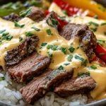Cheesesteak Rice Bowl with steak, peppers, and cheese